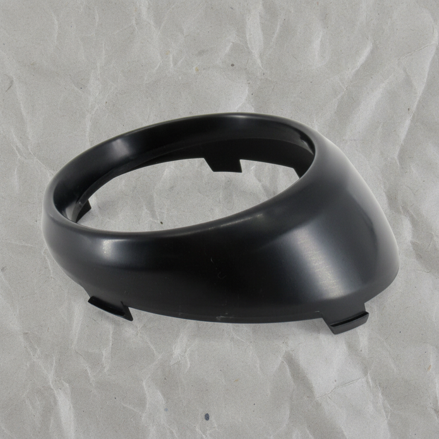 Close-up of Kia OEM Driver Side Fog Light Trim Bezel Gloss Black for 2017-19 Soul