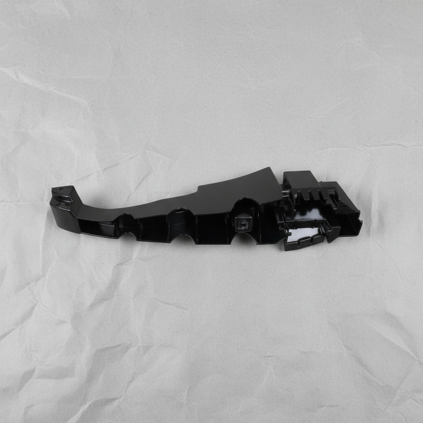 Full view of Dodge Charger rear bumper fascia support bracket on light grey wrinkled kraft paper