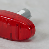 Ford F-350 F-450 Red Side Marker LED Lamp - Bottom Detail on gray wrinkle kraft paper