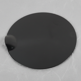 Full view of Ford F-150 fuel tank filler door on light grey wrinkled kraft paper