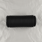 Full view of front suspension strut dust cover on light grey wrinkled kraft paper