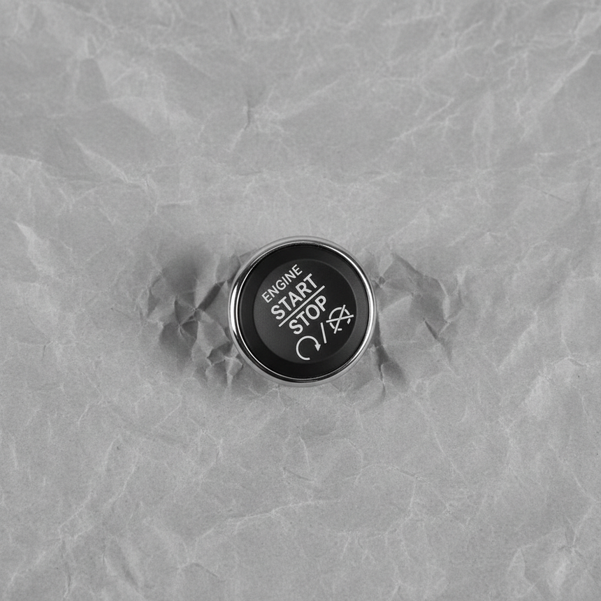 Full View - Engine Start Stop Button on Grey Kraft Paper