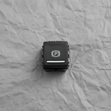 Close-up of GM OEM Parking Brake Control Switch for Cadillac XT5 GMC Acadia Terrain